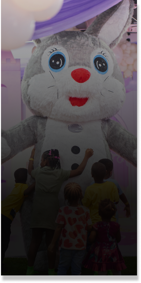 Kids gathered around a bunny mascot